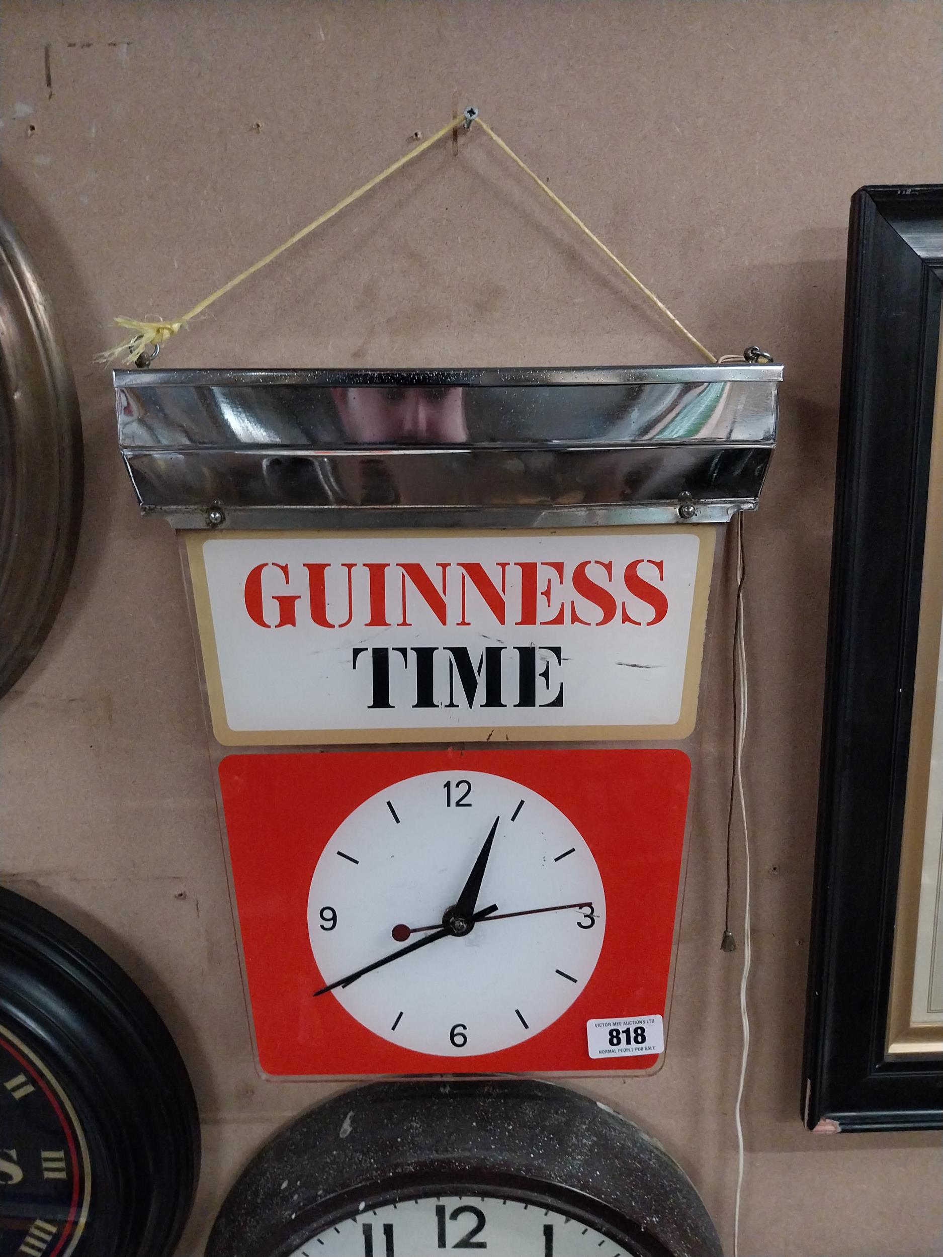 Guinness Time light up Perspex and chrome advertising clock. {43 cm H x 35 cm W x 7 cm D}.