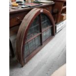 Pair of stained glass arched windows in mahogany frames {76 cm H x 103 cm W}.