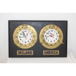 Brass Ireland and America clocks mounted on wooden board {74 cm H x 63 cm W}.