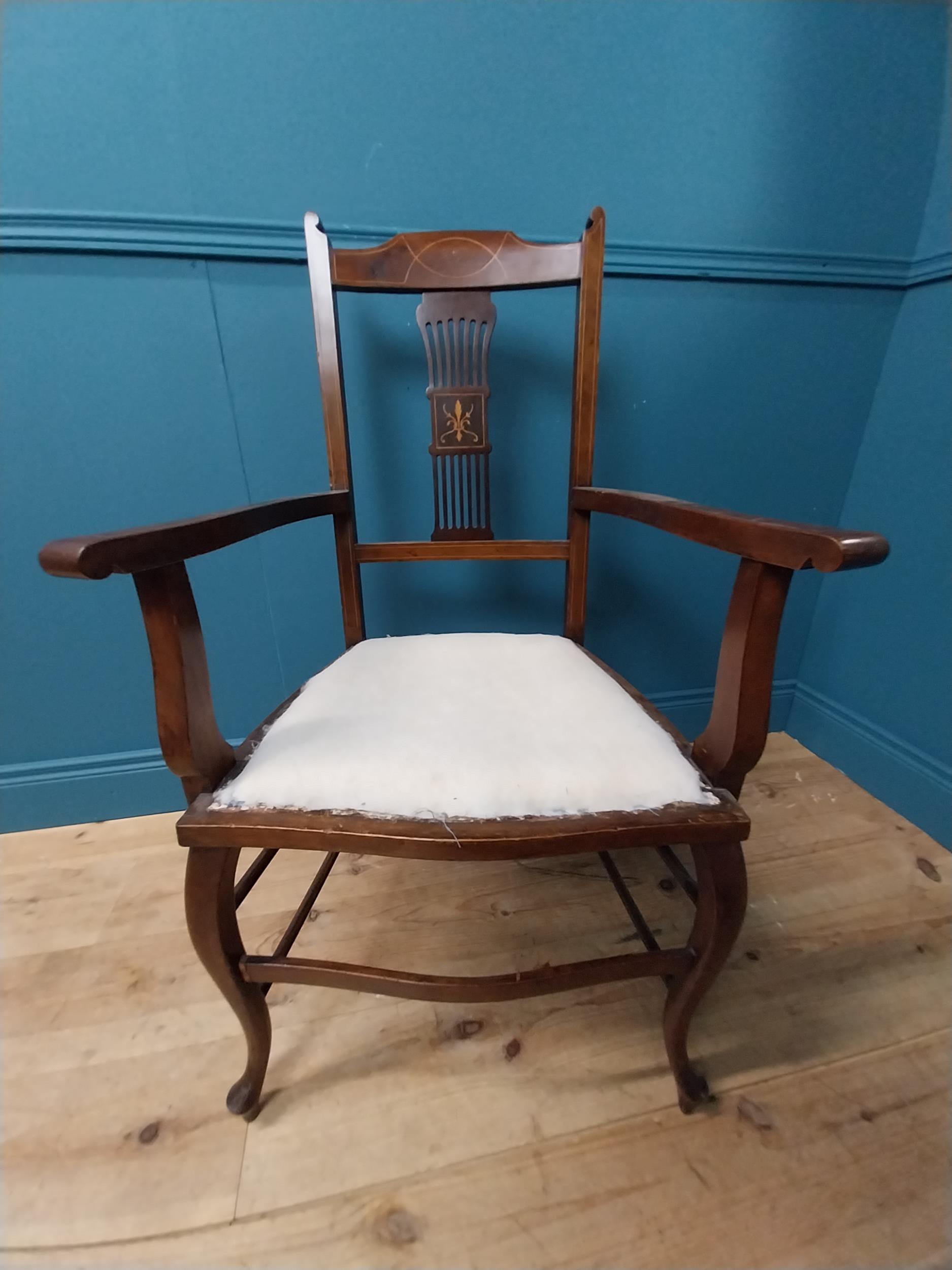 Edwardian inlaid mahogany open armchair raised on cabriole legs.