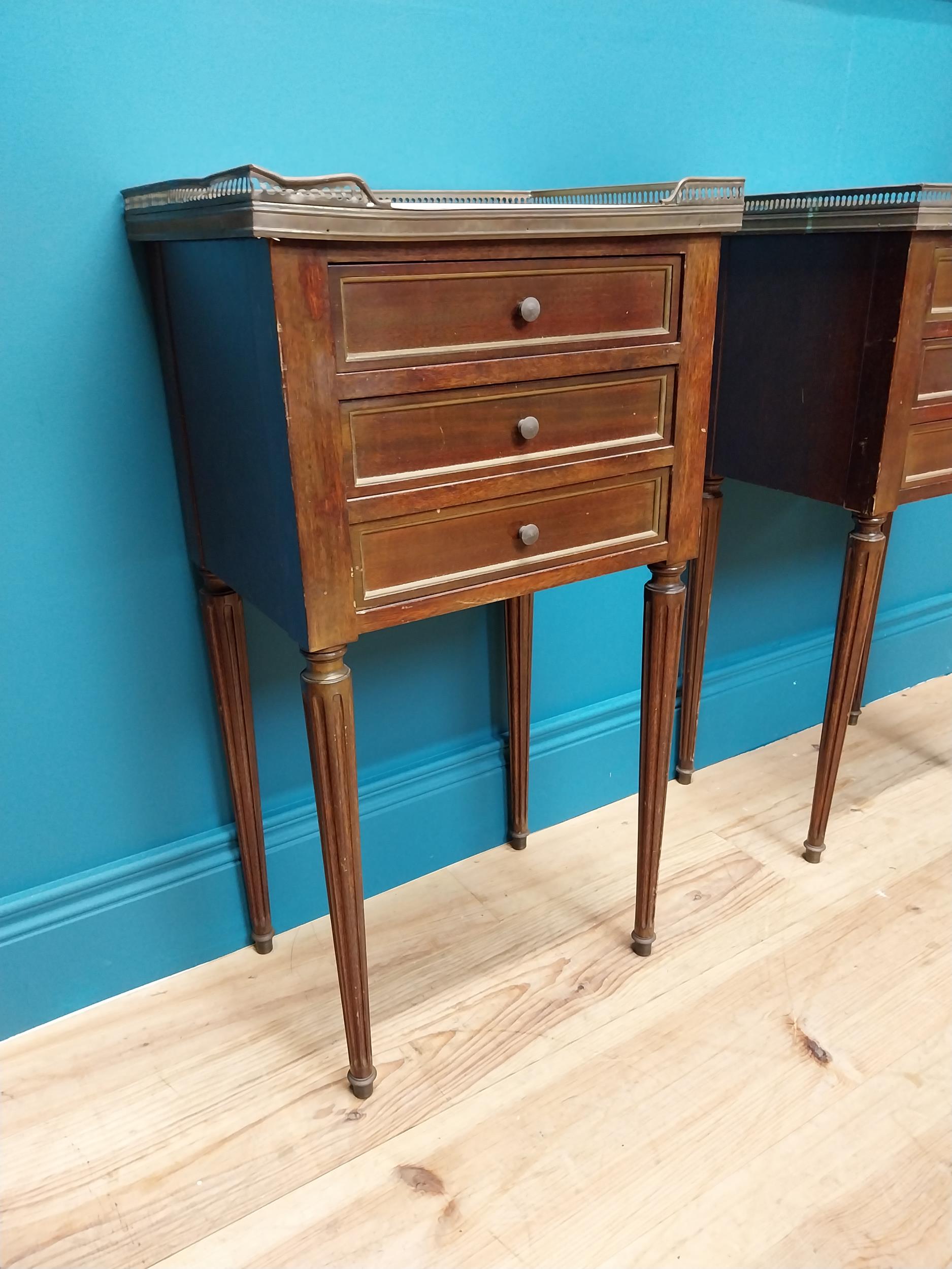 Pair of 19th C. mahogany and brass bedside lockers with inset marble top and three drawers raised on - Image 3 of 5