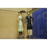 Pair of wooden figurines of a lady and gentleman [H 37cm x Dia 9cm}.