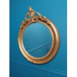 Good quality gilt circular wall mirror with bevelled glass {70 cm H x 60 cm W}.