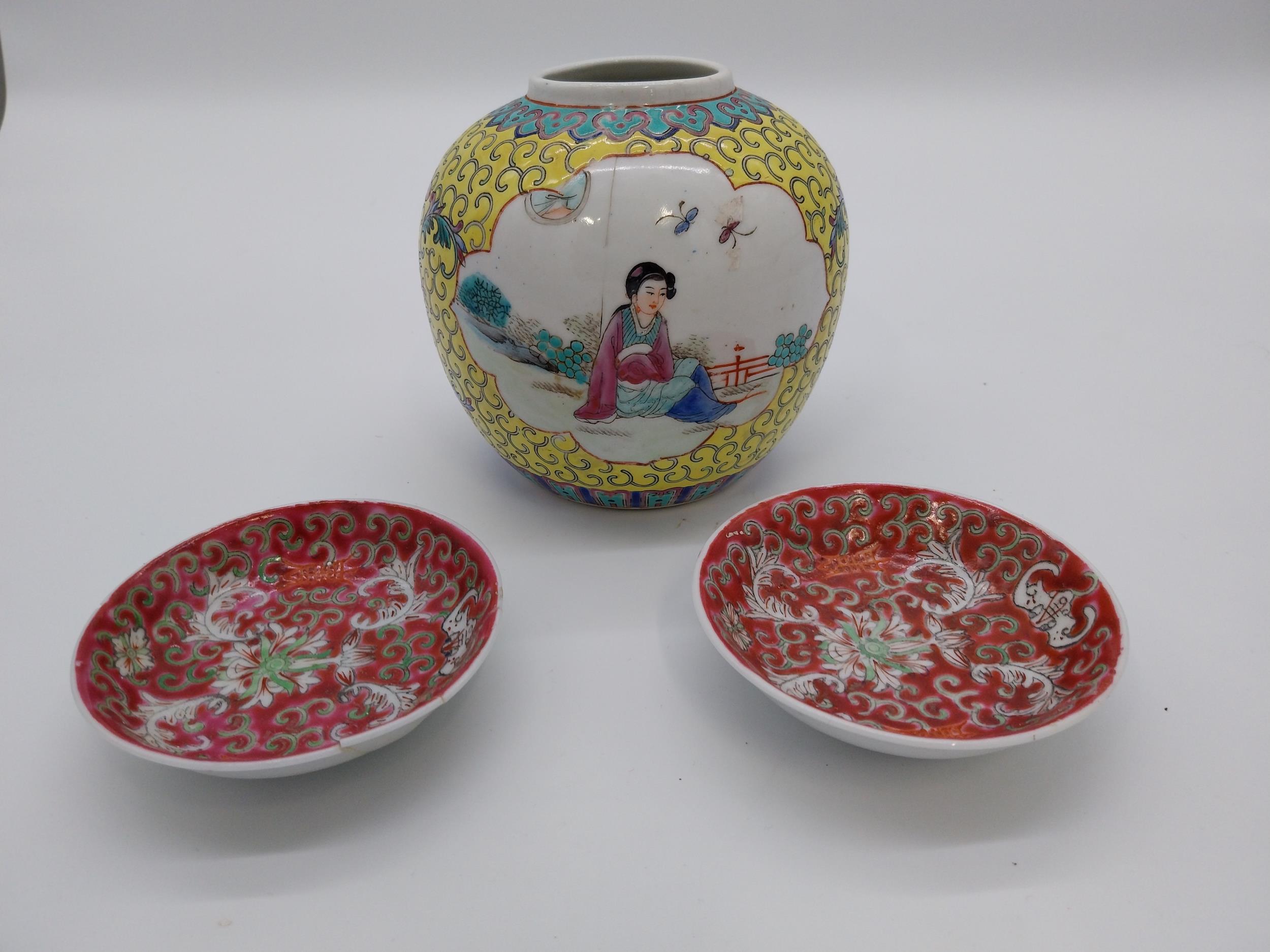 Decorative hand painted ceramic Chinese ginger jar and pair of Chinese ceramic saucers. Jar {13 cm H