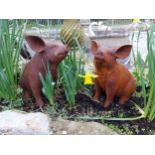 Pair of good quality cast iron pigs. {