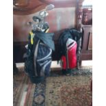 Set of golf clubs in Dunlop golf bag and a Fazer golf bag.