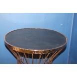 Brass side table with inset black glass top {H 74cm x Dia 60cm}.