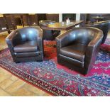 Pair of leather upholstered club chairs {67 cm H x 77 cm W x 79 cm D}.