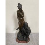 Bronze figure of a Lady and Old man mounted on marble base {69 cm H}.