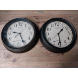 Two metal Plumeet wall clocks. {29 cm Diam}