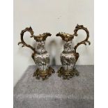 Pair of large decorative ceramic jugs with brass mounts.