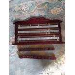 Mahogany and brass snooker score board and que holder {42 cm H x 69 cm W}.