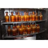 Collection of twenty chemist - pharmacy brown bottles {H 12cm x Dia 6cm}.