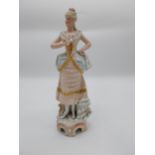 German ceramic figure of a Lady. {36 cm H x 13 cm W x 12 cm D}.