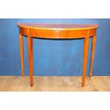 Mahogany demi-lune consul table raised on square tapered legs {H 83cm x W 114cm x D 49cm}.