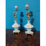 Pair of decorative ceramic and gilded metal candlesticks {36 cm H x 12 cm W x 10 cm D}.