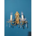 Pair of gilded brass and cut crystal wall sconces {28 cm H x 28 cm W x 16 cm D}.