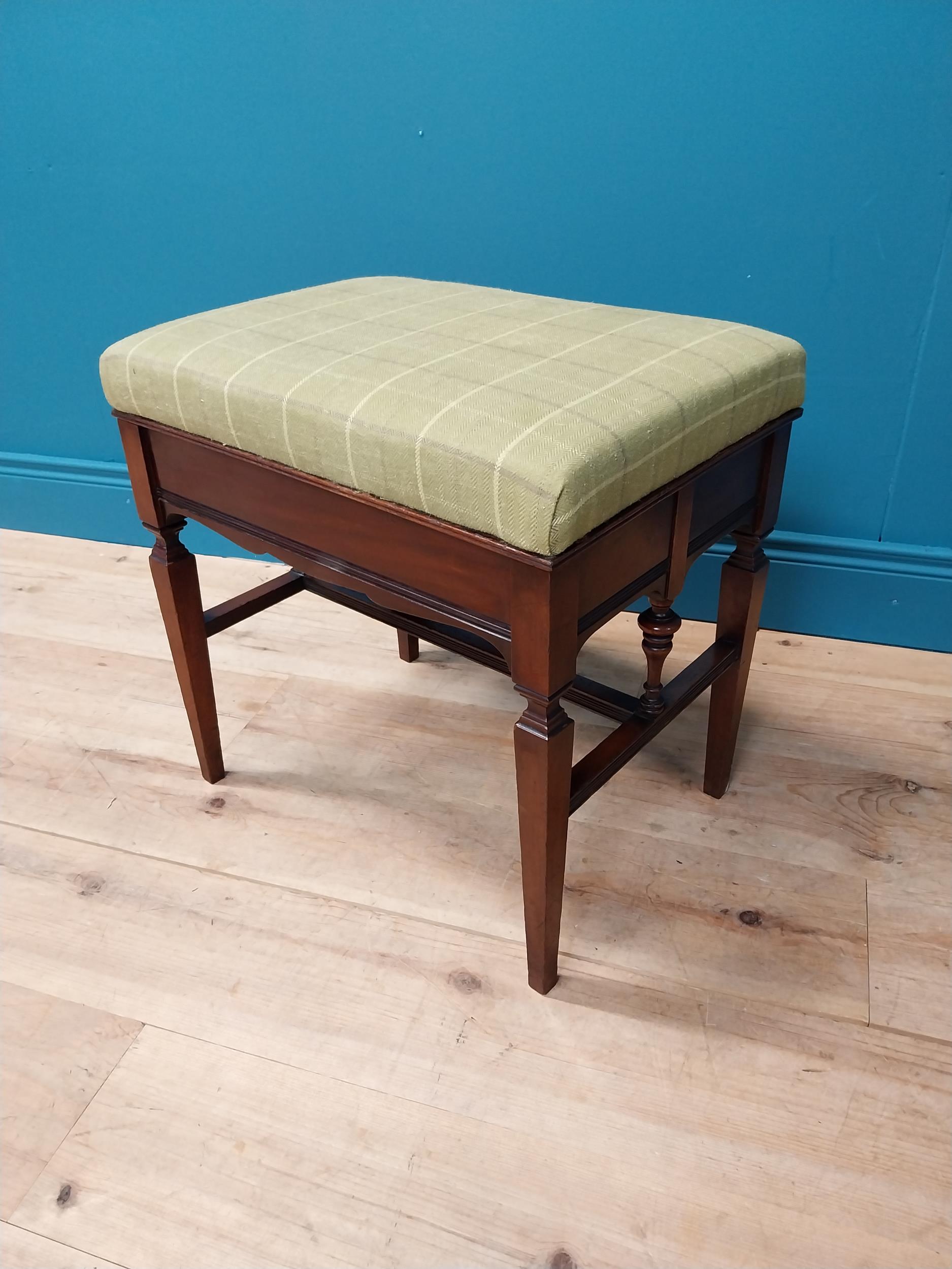 Good quality Edwardian mahogany piano stool with upholstered seat and lift up seat raised on