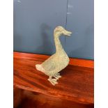 Bronze model of a duck { 22 cm H X 14 cm W X 6 cm D }.