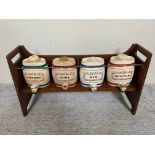 Set of four ceramic Sherry, Port, Gin and Scotch barrels in wooden stand.