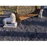 Pair of moulded stone models of Lions with ball at foot. {76 cm H x 80 cm W x 30 cm D}.