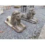 Pair of moulded stone reclining Lions. {52 cm H x 88 cm W x 30 cm D}.