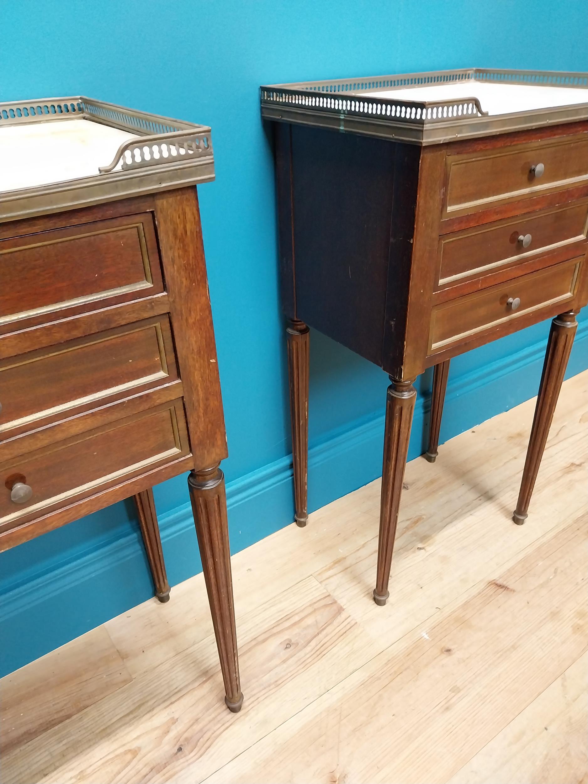 Pair of 19th C. mahogany and brass bedside lockers with inset marble top and three drawers raised on - Image 4 of 5
