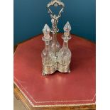 19th. C. silver plated decanter set with three cut glass bottles with original stoppers. { 40cm H