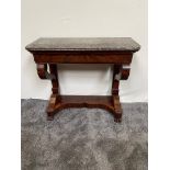 Regency mahogany consul table with marble top raised on platform base and lions paw feet {85 cm H