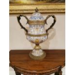 Decorative ceramic and gilded brass lidded urn {66 cm H x 50 cm W x 25 cm D}.