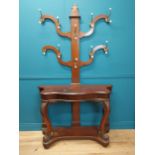 19th C. mahogany hall stand raised on carved legs, lions paw feet and platform base. {207 cm H x 122