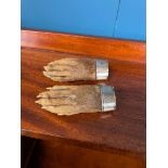 Pair of taxidermy otter paws with silver cuffs inscribed Ld. C. O. N. Foulsksmills 11th Sept.