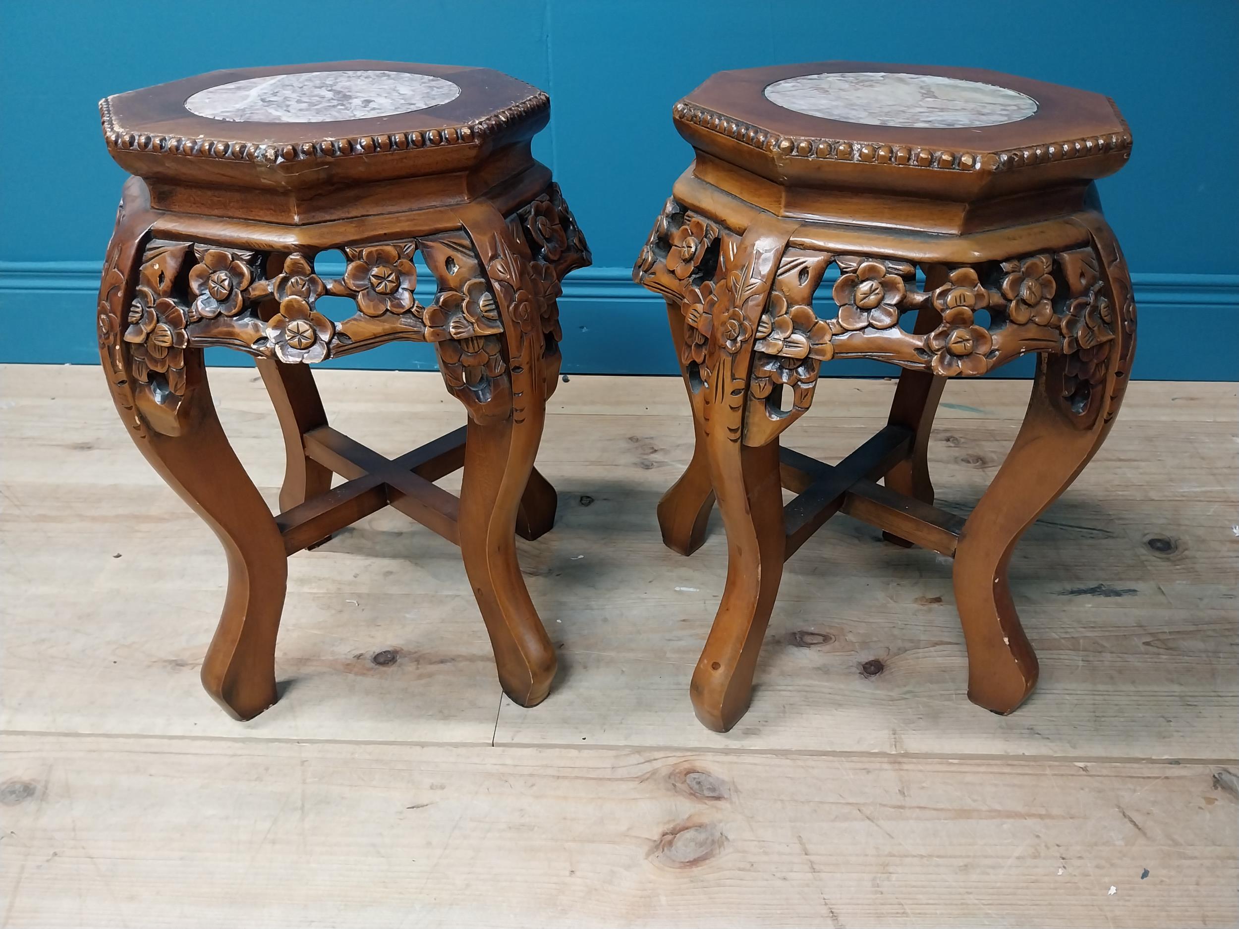 Pair of carved hardwood jardiniere stands with marble inset tops in the Chinese style. :48 cm H x 36