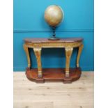 Good quality gilded mahogany consul table raised on carved supports, lion paw feet and platform base