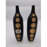 Pair of ceramic vases in the form of a bottle one with damage {33 cm H x 9 cm Dia.}.