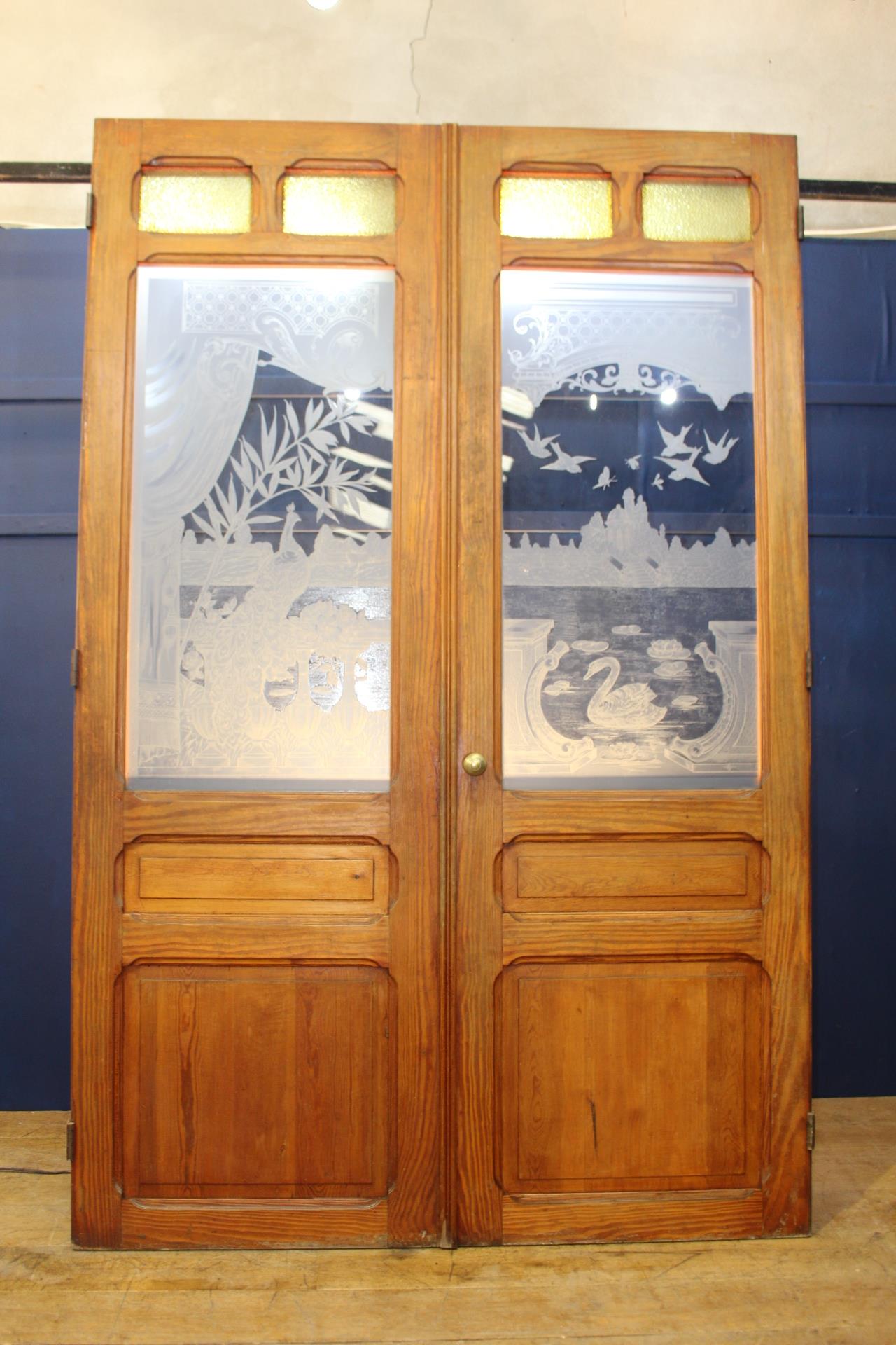 Pair of pitch pine doors with etched glass depicting a scene of balcony with birds {H 243cm x W 80cm