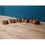 Set of five graduated copper saucepans with metal handles made in France. {10 cm H x 21 cm Diam to 7