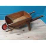 1950's child's wooden wheelbarrow. {28 cm H x 67 cm W x 27 cm D}.