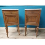 Pair of Victorian oak bedside lockers with marble top and single drawer over single door raised on