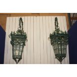 Pair of large French wrought iron Avenue lamps on wrought iron brackets with swag and leaf