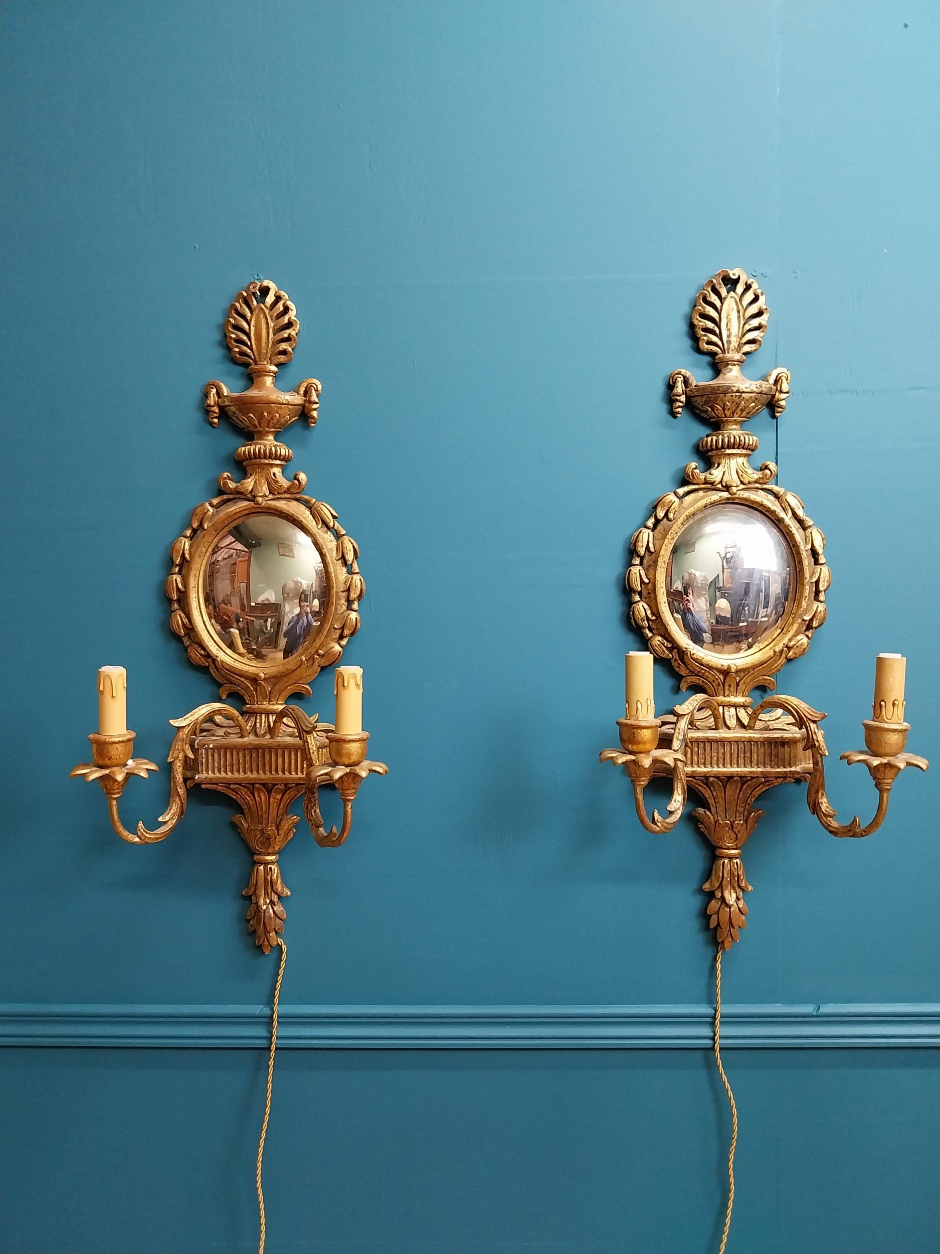 Pair of exceptional quality giltwood mirrored two branch wall sconces in the Adams manner {76 cm H x