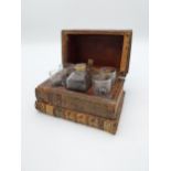 Rare 19th C. decanter box in the form of leatherbound books. {13 cm H x 17 cm W x 12 cm D}.
