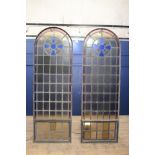 Pair of arched wrought iron leaded glass windows with opening to bottom {Each H 228cm x W 76cm}.