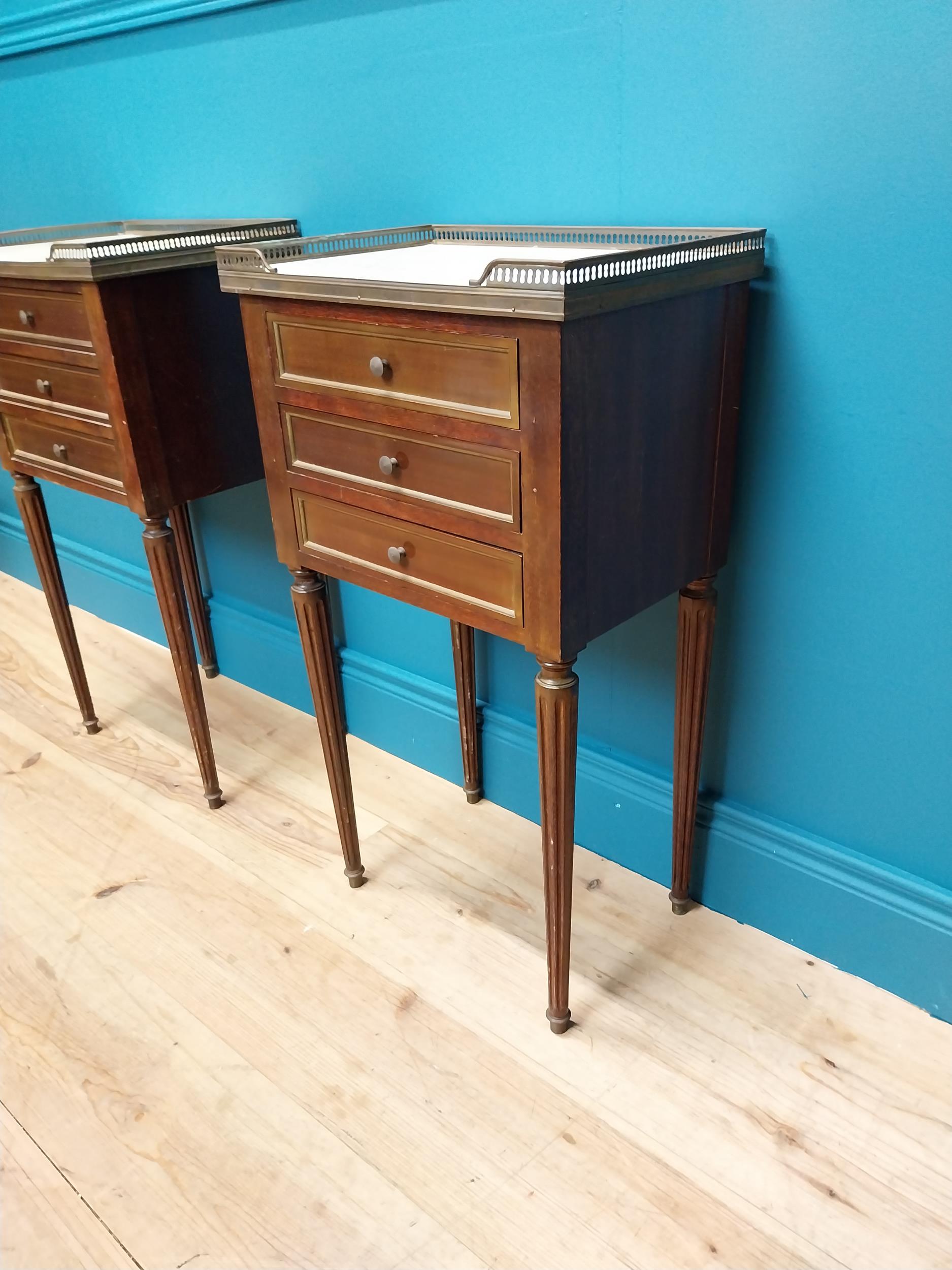 Pair of 19th C. mahogany and brass bedside lockers with inset marble top and three drawers raised on - Image 5 of 5