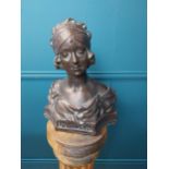 Bronze moulded stone bust in the Art Deco style. {43 cm H x 35 cm W x 19 cm D}.