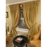 Pair of gold curtains with gilt curtain pole.