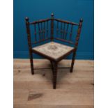 Early 20th C. mahogany corner chairs with holstered seat raised on spindle supports {77 cm H x 59 cm