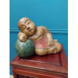 Carved hardwood model of a sleeping Buddha {24 cm H x 36 cm W x 17 cm D}.