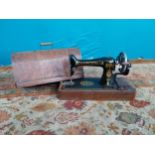 Singer sewing machine in original case. {35 cm H x 52 cm W x 22 cm D}.