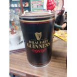 Rare Draught Guinness tin plate glass holder in the form of a Guinness can. {36 cm H x 22 cm Diam}.